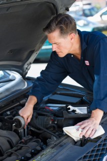 Mechanic repairing car.