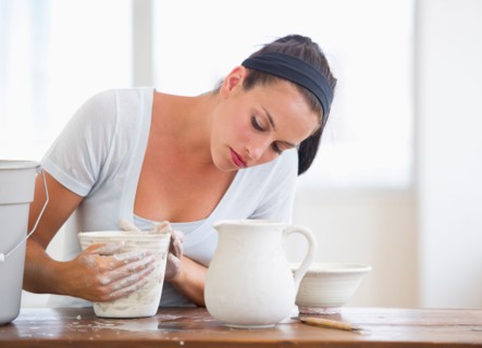 Woman making pottery.