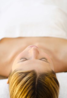 Woman relaxing at health spa.