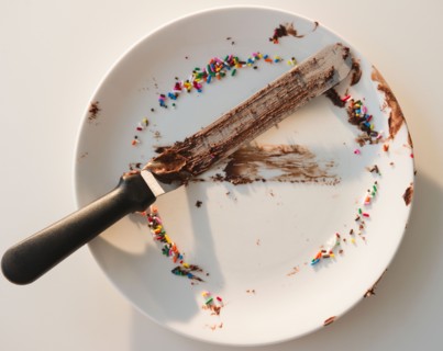Close up of empty plate with rests of chocolate and sprinkles. Photo : Jamie Grill