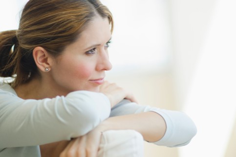 Pensive woman relaxing.