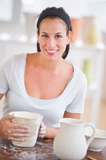 Woman making pottery.