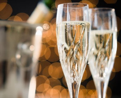 Close up of champagne flutes and ice bucket. Photo : Jamie Grill
