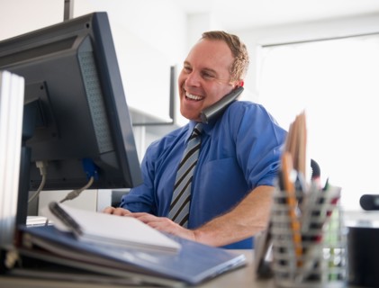 Businessman working in office. Photo : Jamie Grill