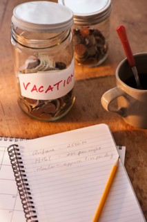 Close up of jar with money for vacations. Photo : Daniel Grill