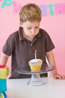 Close up of boy (4-5) celebrating birthday. Photo : Daniel Grill