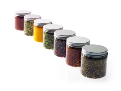Studio shot of row of jars with spices. Photo: David Arky