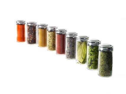 Studio shot of row of jars with spices. Photo : David Arky