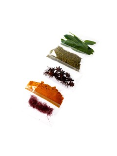 Studio shot of row of packets with spices. Photo: David Arky
