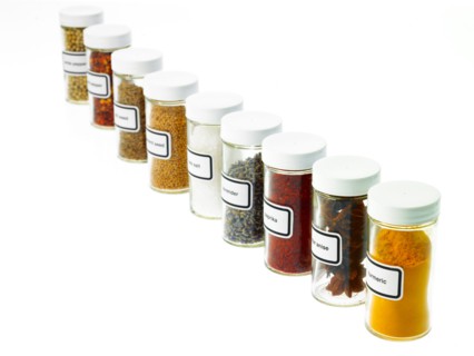 Studio shot of Jars with spices on white background. Photo : David Arky