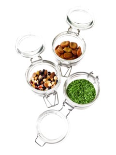 Studio shot of jars with Mixed Seeds on white background. Photo : David Arky
