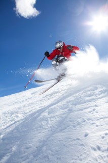 Male skier on fresh powder snow