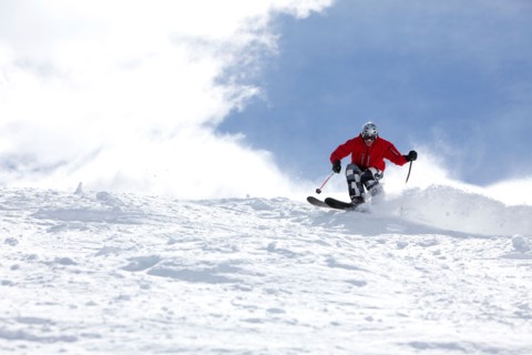 Male skier on fresh powder snow