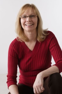 Portrait of mature woman, studio shot. Photo: Rob Lewine