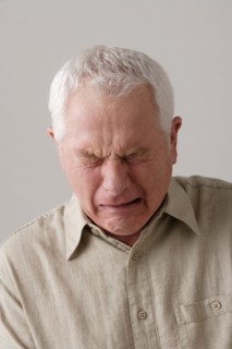 Portrait of senior man crying, studio shot. Photo: Rob Lewine