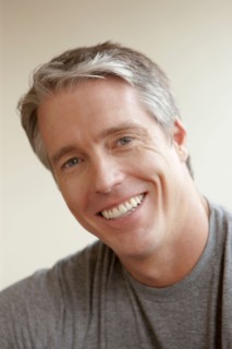 Portrait of cheerful mid adult man. Photo : Rob Lewine