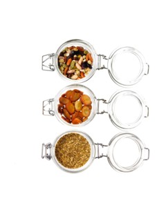 Studio shot of jars with Mixed Seeds on white background. Photo : David Arky