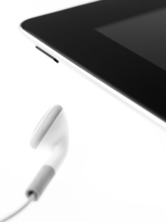 Studio shot of mp3 player and earphone. Photo : David Arky