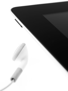 Studio shot of mp3 player and earphone. Photo : David Arky