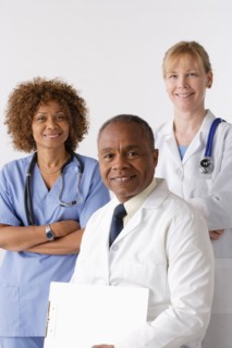 Portrait of three medical professionals, studio shot. Photo : Rob Lewine