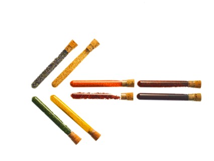 Studio shot of Test Tubes making Arrow shape on white background. Photo : David Arky