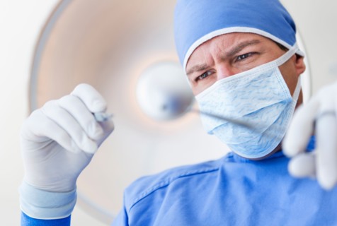Male surgeon in operating room.