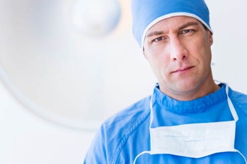 Portrait of male surgeon in operating room.
