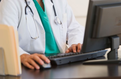 Doctor using computer.