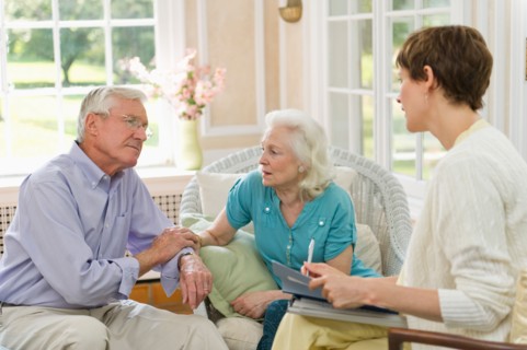 Nursing assistant talking with seniors in Nursing home.