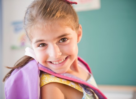 Portrait of smiling schoolgirl ( 6-7). Photo : Jamie Grill