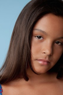 Studio portrait of sad girl (10-11). Photo : Rob Lewine