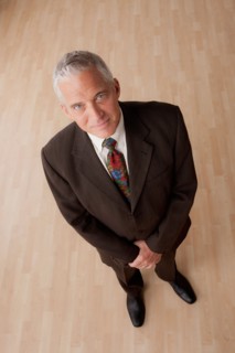 Portrait of smiling senior businessman. Photo: Rob Lewine
