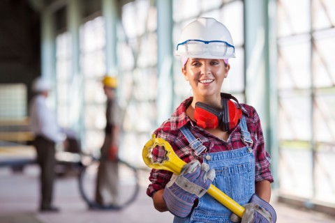 Portrait of female manual worker wearing hardhat. Photo : db2stock