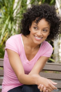 Portrait of young woman smiling. Photo : Rob Lewine