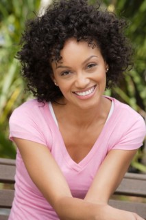 Portrait of young woman smiling. Photo : Rob Lewine