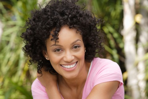 Portrait of young woman smiling. Photo : Rob Lewine