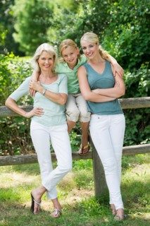 Portrait of girl (10-11) with mother and grandmother.