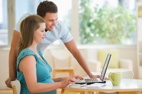 Young couple using laptop.