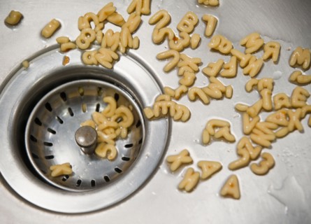 Close up of letter noodles in kitchen sink. Photo: Jamie Grill