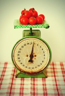 Studio shot of tomatoes on scales.