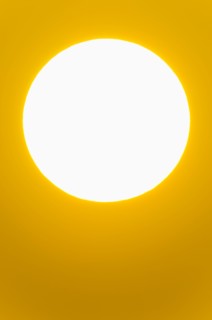Close-up of large red sun.