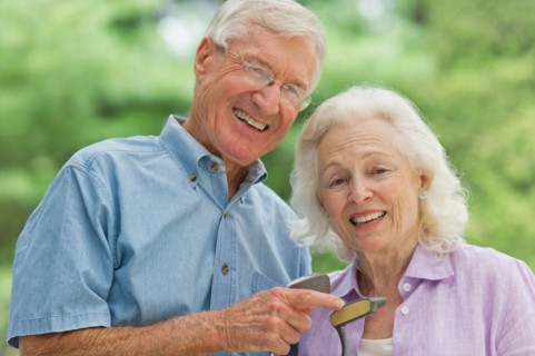 Senior couple playing golf.