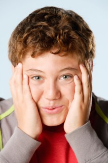 Studio portrait of boy (12-13). Photo : Rob Lewine