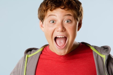 Studio portrait of boy (12-13) looking surprised. Photo : Rob Lewine