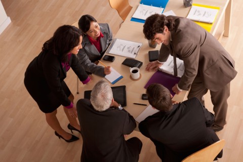 Business meeting, high angle view. Photo : Rob Lewine