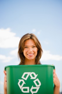 Woman holding recycling bin. Photo : Jamie Grill