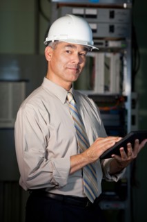 Portrait of male technician wearing hardhat. Photo : db2stock