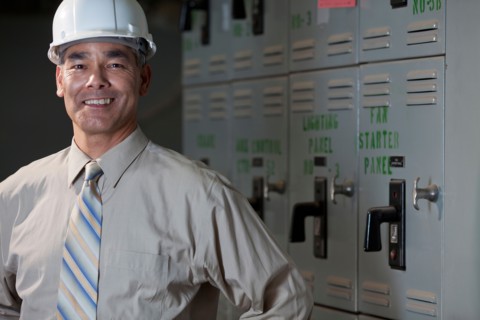 Portrait of male technician wearing hardhat. Photo : db2stock