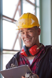 Portrait of male manual worker wearing hardhat. Photo : db2stock