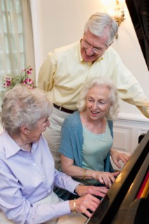 Seniors playing piano and singing.